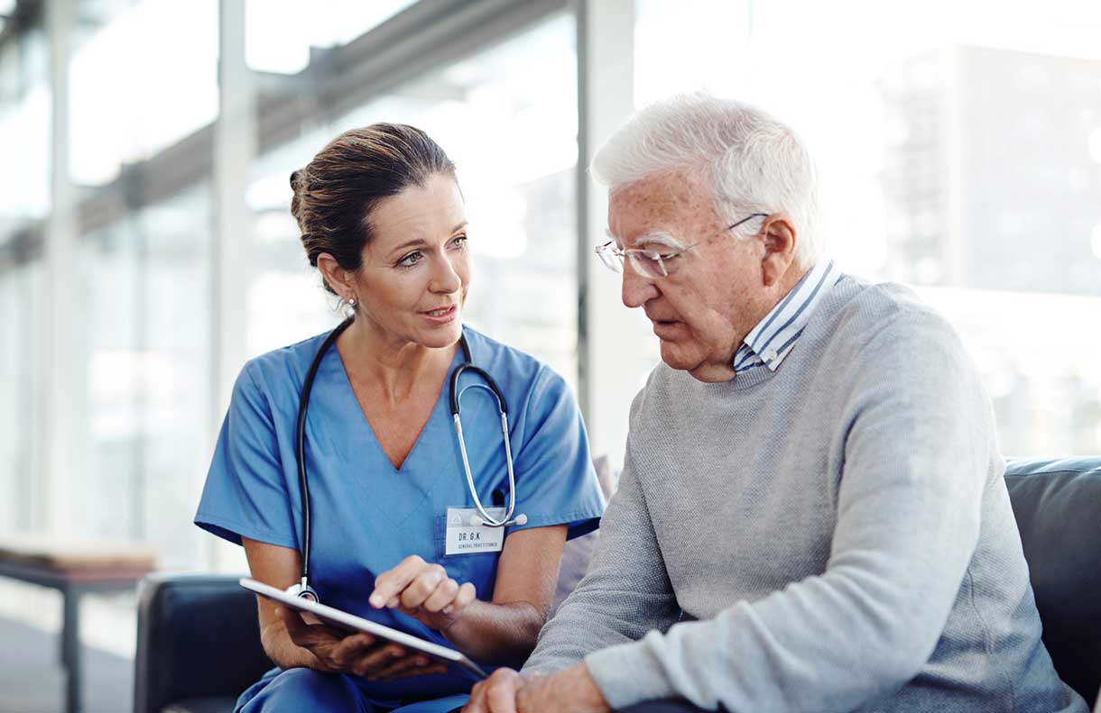 Doctor consulting with elderly patient
